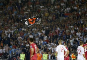 An Albanian flag is flown over the pitch during the Euro 2016 Group I qualifying soccer match between Serbia and Albania at the FK Partizan stadium in Belgrade October 14, 2014. The Euro 2016 qualifier between Serbia and Albania was halted in the first half.